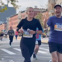Supporters Cheer on New York City Marathon Runners