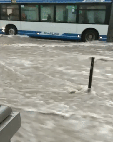 Buses, Motorcycles Wait Out Wuppertal Flash Flooding