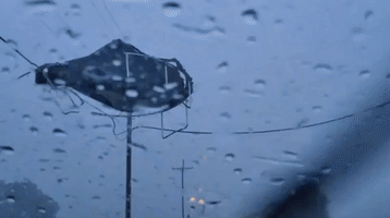 Stormy Weather Blows Trampoline Into Power Lines