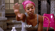 TV gif. Young woman wearing a pink hair bonnet and a gray tank top holds up a hand saying, "Stop."