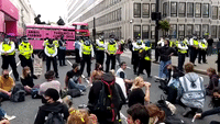 Police Remove Vehicle After Animal Rights Protesters Block Road in London