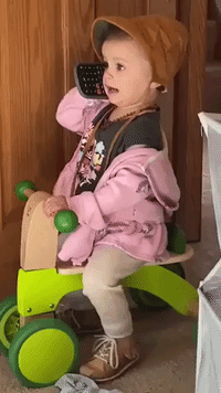 'Bye!': Cute Little Girl Makes ‘Phone Call’ on a Calculator