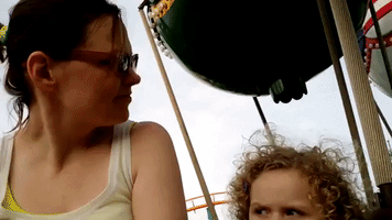 Little Girl is Less Than Impressed With Amusement Ride