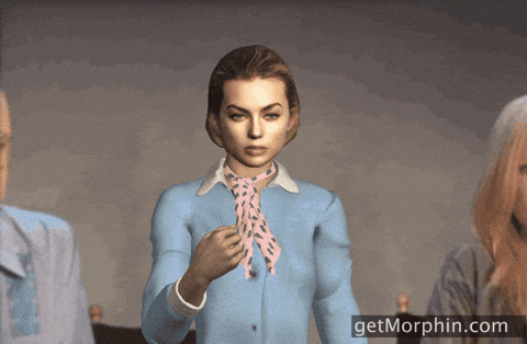 Cartoon gif. Margot Robbie in a blue shirt and pink scarf stares at us with a serious, yet blank expression while she throws gold confetti into the air.