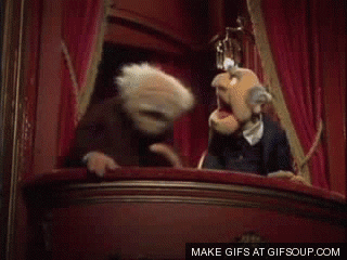 Sesame Street gif. Watching from the balcony at a theater, old men muppets Statler and Waldorf laugh wildly.