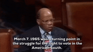 Political gif. John Lewis speaks on the floor of Congress. He says, "March 7, 1965 was a turning point in the struggle for the right to vote in the American South" which also appears as text.