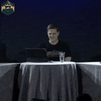 Video gif. A man sitting behind an open laptop turns to the side with a smile and says, "That's rogue like."