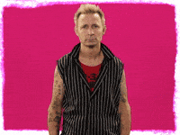 Celebrity gif. Mike Dirnt of Green Day slams a fist into his forehead with a look of annoyance. 