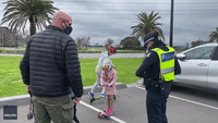Kids Play on Scooters as Father Questioned by Police in Melbourne Over Lockdown Restrictions