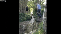 Man Trying to Jump Small Stream on Unicycle Prevai