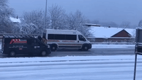 Office Workers Push Start Ambulance Stuck on Icy Road