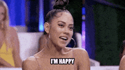 Reality TV gif. Woman with a top-knot on Ex on the Beach smiles agreeably and nods confidently while she says, "I'm happy," which appears as text.