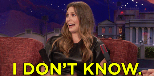Late Night gif. Elizabeth Olsen sits on the couch on Conan. She looks out at the audience with an exaggerated worried look, shaking her head with her eyes wide, as she says, “I don’t know.”