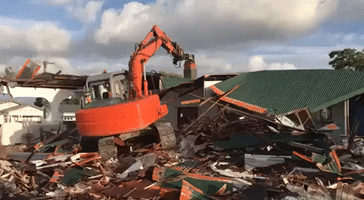 Excavator Pushes Wall Into Neighbour's Home During Auckland Home Demolition