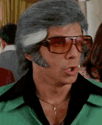 Movie gif. Ben Stiller as Starsky in Starsky and Hutch raises his eyebrows and looks at someone as he eggs them on. Text repeats, "do it."