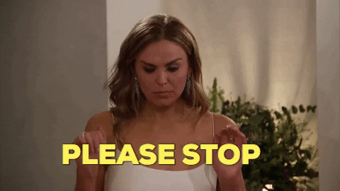 Reality TV gif. Hannah Brown in The Bachelorette holds her fists up beside her chest and closes her eyes as she says, "Please stop."