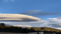 Lenticular Clouds Hang Against Blue Colorado Sky
