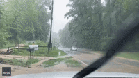 Cars Manoeuvre Through Inundated Roads Amid Flash Flood Warnings in Ohio