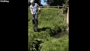 Man Tries to Jump Small Stream on Unicycle