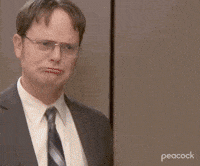 The Office gif. Rainn Wilson as Dwight and Andy Buckley as David embrace in a warm and happy hug. 