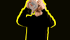 Celebrity gif. Louis Vecchio from the and New Politics dumps an entire bucket of popcorn into his mouth as it pours all over him.