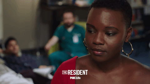 the resident smile GIF