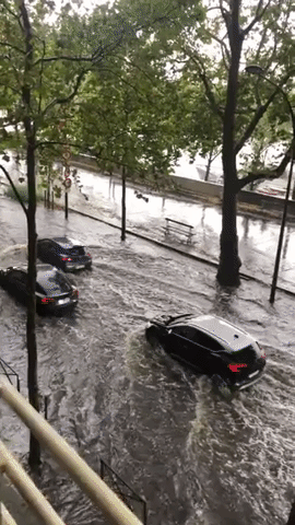 Cars Navigate Flooded Streets in Paris