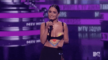 Vanessa Hudgens Shrug GIF by MTV Movie & TV Awards