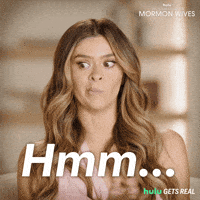 Sponsored gif. Reality star Taylor Frankie Paul from the reality show “The Secret Lives of Mormon Wives” purses her lips before going wide-eyed and saying okay. Text in front of her reads, “Hmmm…okay.”