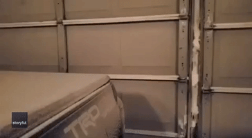 Buffalo Garage Door Opens to Reveal Wall of Snow