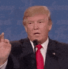Politics gif. Donald Trump behind a mic, raises his index finger and opens his mouth, about to speak, then drops his hand and closes his mouth.