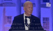 Video gif. President Joe Biden stands behind a podium at the 2024 White House Correspondents' Dinner as he delivers a joke. Recounting a conversation he had with First Lady Jill Biden assuring her of his readiness for his remarks, he says, "I told her, 'Don’t worry. It’s just like riding a bike.'" He pauses for comedic effect then says, "She said, 'That’s what I’m worried about!"