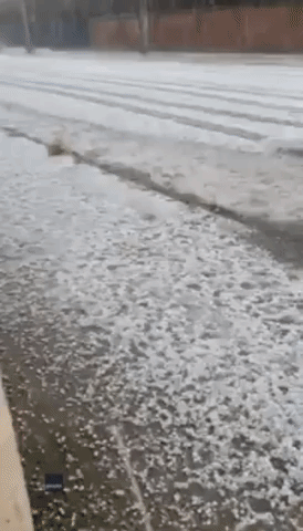 River of Hail Gushes Down Melbourne Street As Storms Move Across Victoria