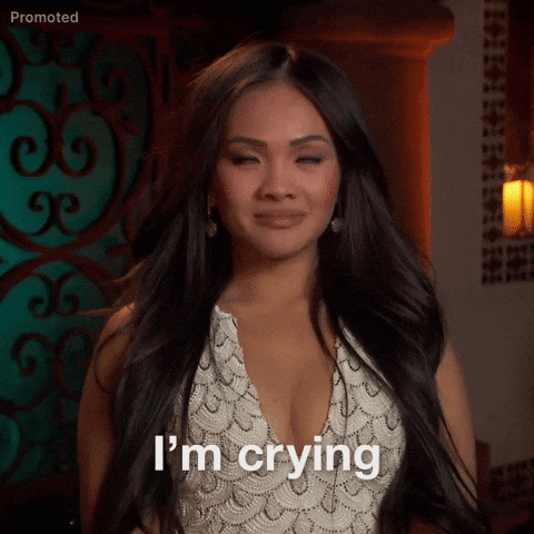 TV gif. Bachelorette Jenn Tran opens arms in a "W" shape with a look of acceptance while saying "I'm crying"