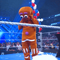 Unmasking Gingerbread Man GIF by WWE