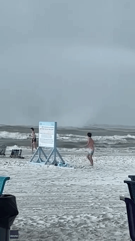 Beachgoers Scramble as Waterspout Makes Landfall