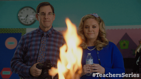 fire conspiring GIF by Teachers on TV Land