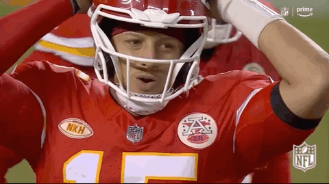 Sports gif. Slow motion clip of Patrick Mahomes of the Kansas City Chiefs stands on the field with his hands on his head like he's disappointed or surprised.