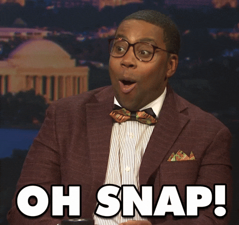  SNL gif. Kenan Thompson is dressed up in a nerdy suit with a bow tie and big square glasses on his face. He looks genuinely shocked and says “Oh Snap!”-- emphasis on the “oh. "