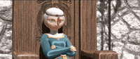 Disney gif. Merida in "Brave" sits in a regal throne and pulls her white headcovering further over her forehead to conceal a lock of red hair emerging.
