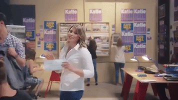 katie hill rips paper GIF