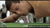 Movie gif. Adam Sandler as Happy Gilmore on his hands and knees, angrily yelling at a golf ball only a few inches away from the hole.