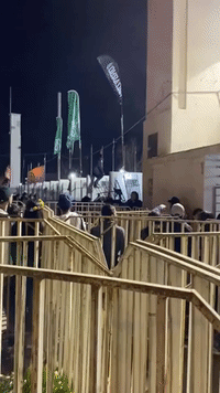 Daddy Yankee Fans Pull Down Fence at Santiago's National Stadium