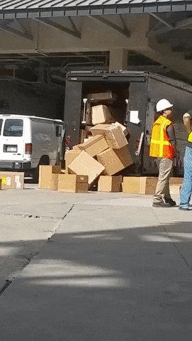 Video gif. A delivery truck is unloading boxes and there's a pile of boxes on the floor that grows to the same size as the truck. They continuously throw out boxes and it seems like it never ends.