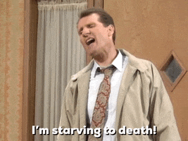 TV gif. Ed O'Neill as Al Bundy on Married with Children stands in the doorway and shouts "I'm starving to death!"