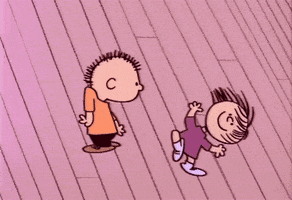 Cartoon gif. From the dancing scene in A Charlie Brown Christmas, it's two obscure side characters: a boy and a girl with some unusual dance moves.