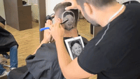 Talented Barber Creates Kim Jong-un Portrait in Man's Hair