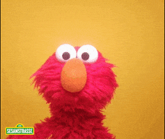 TV gif. Elmo from Sesame Street excitingly waves his fuzzy arm with lots of energy and gives a huge smile to the camera.