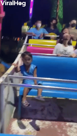 Child Just Chills on Amusement Park Ride   
