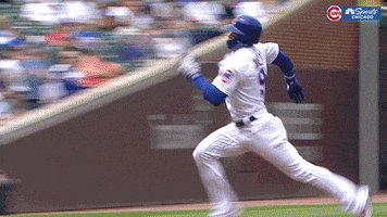 Sports gif. Javier Baez of the Chicago Cubs slides smoothly onto a base with a stoic expression.